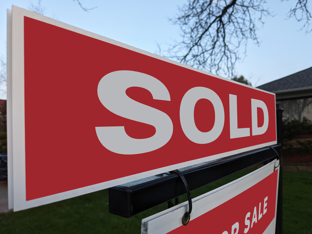 Buying a home - sold sign